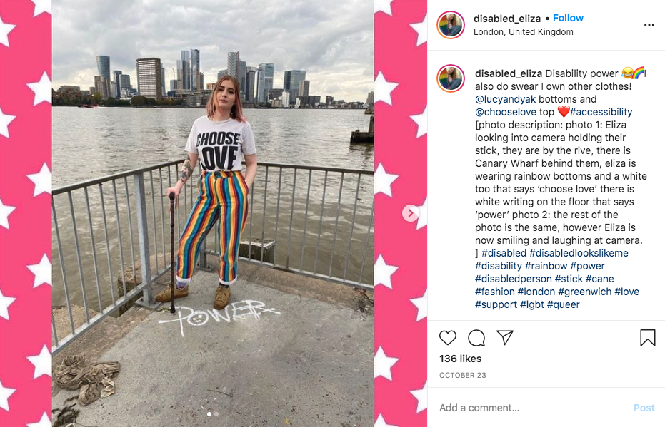 A screenshot of an instagram post that shows a caption with an image description. The image features Eliza looking into the camera holder their stick by the river. 